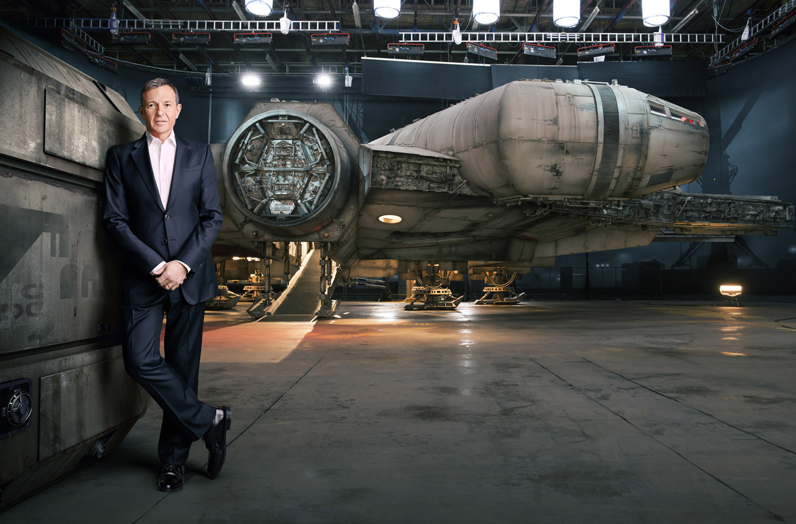 Bob Iger standing in front of the Millennium Falcon